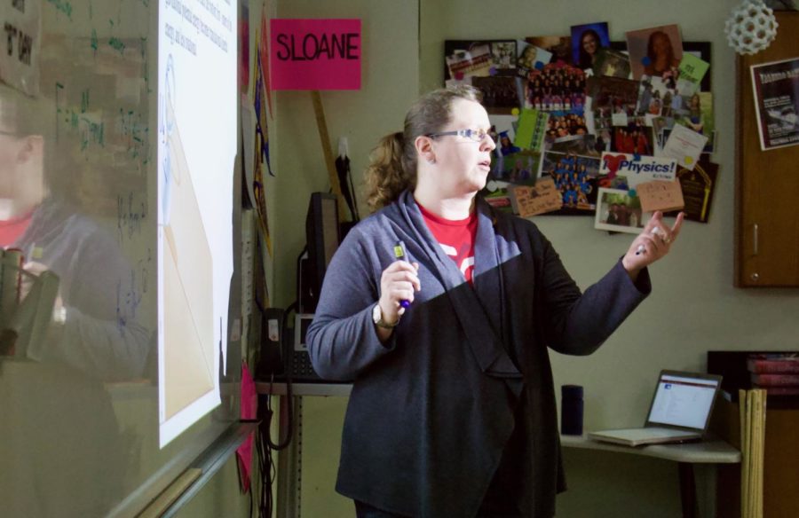 Coppell High School AP/GT Physics I teacher Stephanie Sloane teaches students about rotational momentum and rotational kinetic energy during fifth period. Students learn physics through labs, activities, and oral lectures.