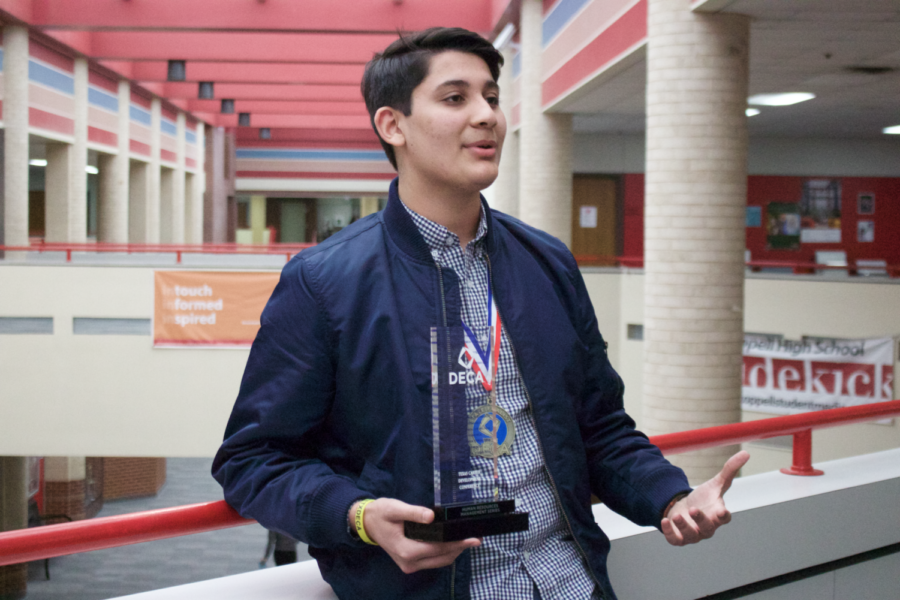 Coppell High School senior Saket Ashar explains the process of winning an award at the DECA state competition this weekend. Last year, Saket placed in the top ten ranks at the international DECA competition and plans to attend the international competition in Orlando this year. 
