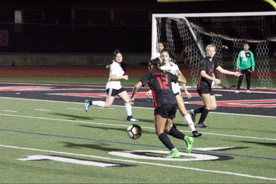 Coppell sophomore midfielder Jocelyn Alonzo takes a goal during the match against Irving at Buddy Echols Field on Feb. 5. The Cowgirls won, 4-0.