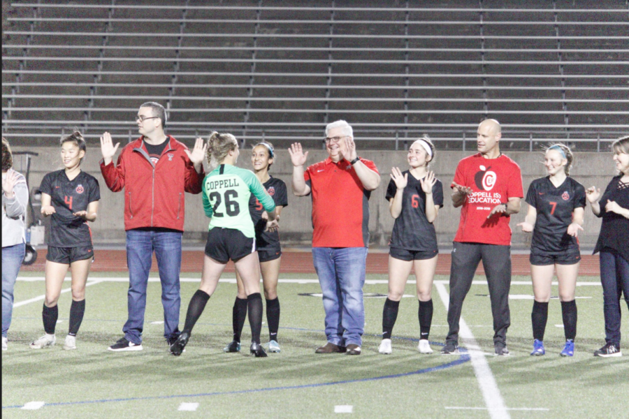 The Coppell girls soccer players and teachers celebrate Teacher Appreciation NIght on Tuesday at Buddy Echols Field. The Cowgirls won, 4-0, over Irving.