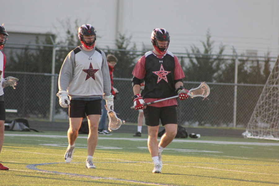 Coppell High School seniors Ethan and Luke Bivens run drills during after school practice on March 6, at the CHS9 practice field. The Bivens have been playing lacrosse since seventh grade, and are preparing for their upcoming senior spring season.