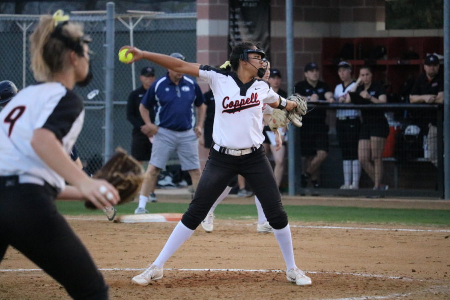 Coppell senior Nora Rodriguez pitches against Flower Mound during the first inning at Coppell ISD Baseball/Softball Complex on Friday. The Cowgirls lost to the Jaguars, 3-2. 