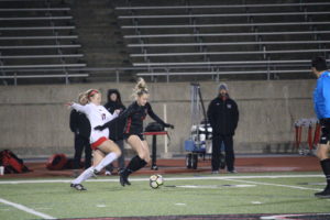Coppell junior forward Micayla Weathers keeps her feet on the ball to pass it to her teammate on Friday at the Buddy Echols Field. The Cowgirls defeated the Lady Marauders, 2-1. 
