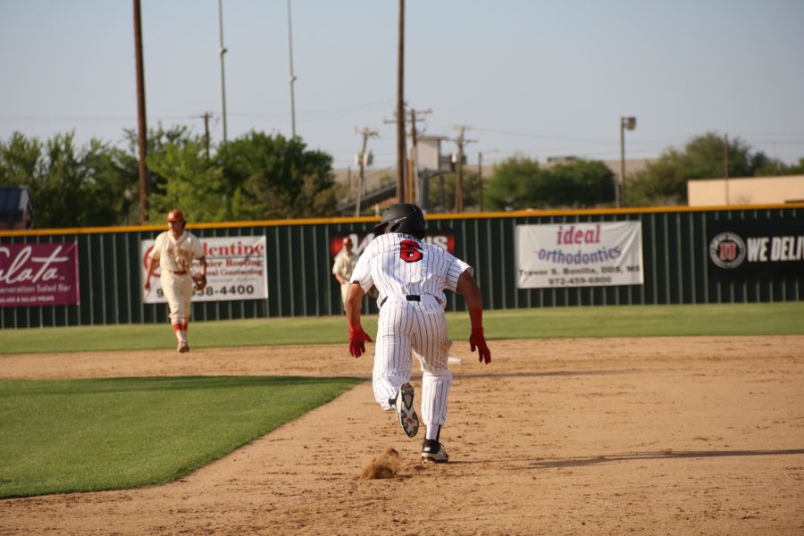 Coppell senior outfielder De Heath breaks for second on last season at Cowboy Field against WT White. The Cowboys will play the Hebron Hawks tonight at 7 p.m. at the CISD baseball/softball complex. 