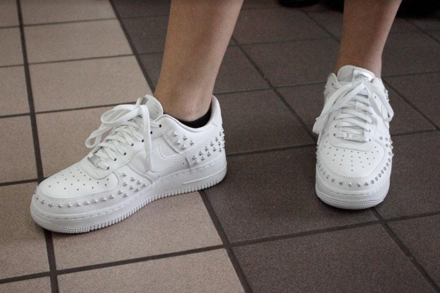Coppell High School sophomore Paulina Morlett wears silver star studded Nike Air Force 1 sneakers on Tuesday. Recently at CHS, students have been following the chunky dad sneaker trend seen on the internet.