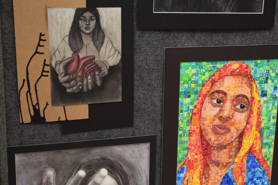 CHS AP/IB students showcase their art on display on Thursday night in the CHS Commons. Students who are involved in AP/IB art classes have worked on their pieces all year and showcase their artwork on tables and on display.