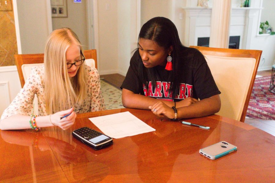 Coppell High School senior Peyton Williams tutors CHS sophomore Lauren Myers for Algebra II on April 22 at Myer’s residence. Williams has tutored students in a variety of subjects throughout high school and is attending Harvard University in fall 2019.