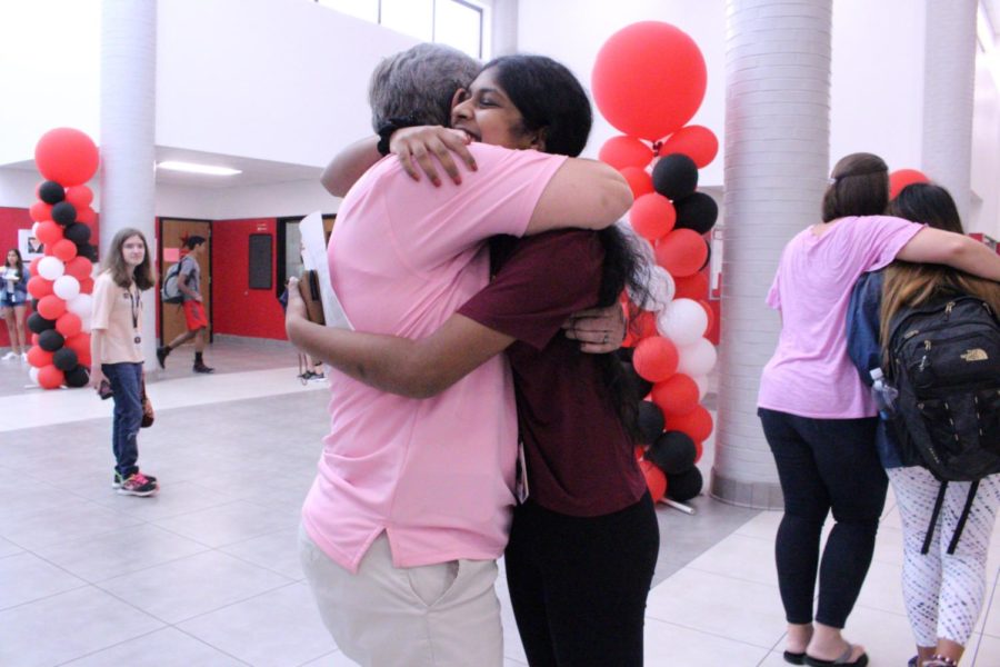 Coppell High School Principal Laura Springer hugs CHS sophomore Megna Gopinath as a sign of welcoming to the new school year. Springer comes to CHS from Coppell Middle School East and is bringing several changes to the campus.