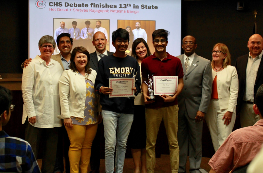 Coppell High School seniors Shreyas Rajagopal and Het Desai are recognized for placing 13th in the National Speech and Debate Tournament in July during Monday’s Coppell ISD Board of Trustees meeting at the Vonita White Administration Building. The board also approved the 2019-20 CISD budget. Photo taken by Neveah Jones.