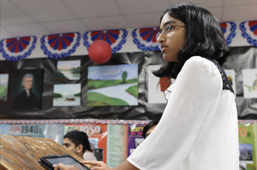 Coppell High School junior and prosecution attorney Devka Kohli questions witnesses on the stand in AP U.S. history teacher Diane deWaal’s classroom on Wednesday. APUSH teachers hold mock courts trial to teach about the Boston Massacre as well as give students a hands on experience of what a court trial is really like. 
