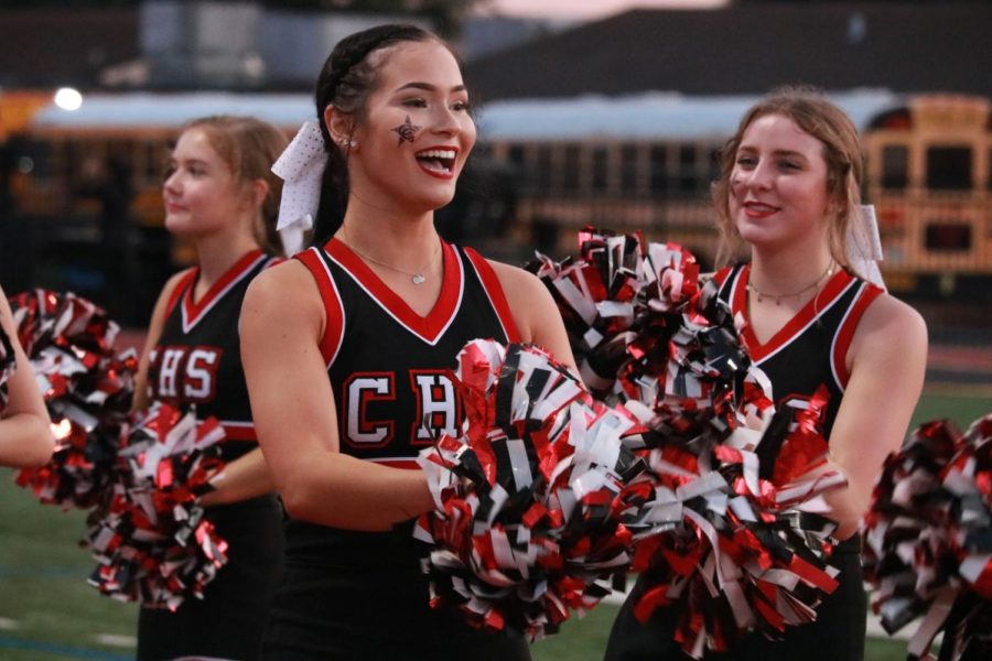Coppell High School junior cheer captain Emersyn Jorski riles up the student section during the first football game against Sachse at Williams Stadium on Aug. 30. Outside of school, Jorski is a published model and a Spirit of Texas Royalty alumna.