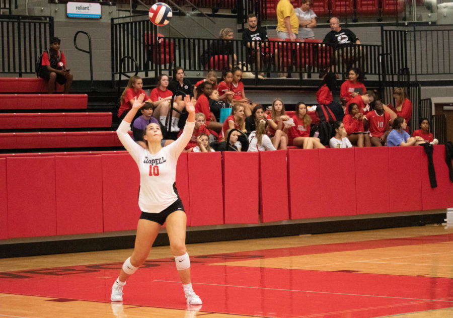 Coppell senior setter and right side hitter Kinsey Bailey serves during the second set of Friday’s District 6-6A opener against Nimitz at the CHS Arena. The Cowgirls defeated the Vikings, 25-16, 25-17, 25-17.
