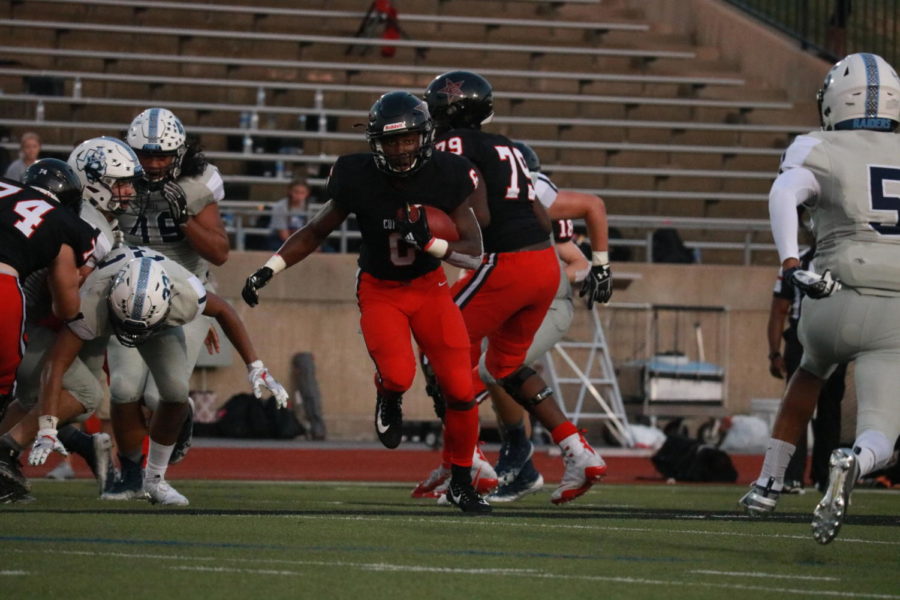 Coppell+junior+running+back+Jason+Ngwu+rushes+during+the+game+against+L.D.+Bell+on+Sept.+6+at+Buddy+Echols+Field.+The+Cowboys+face+Allen+at+Eagle+Stadium+tomorrow+at+7+p.m.