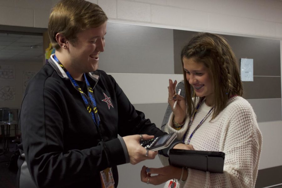 CHS9 Algebra I teacher William Harrington helps freshman Tyler Garner solve an equation during a scavenger hunt on Thursday. Harrington is a new math teacher at CHS9 for the 2019-20 school year. Photo by Neveah Jones