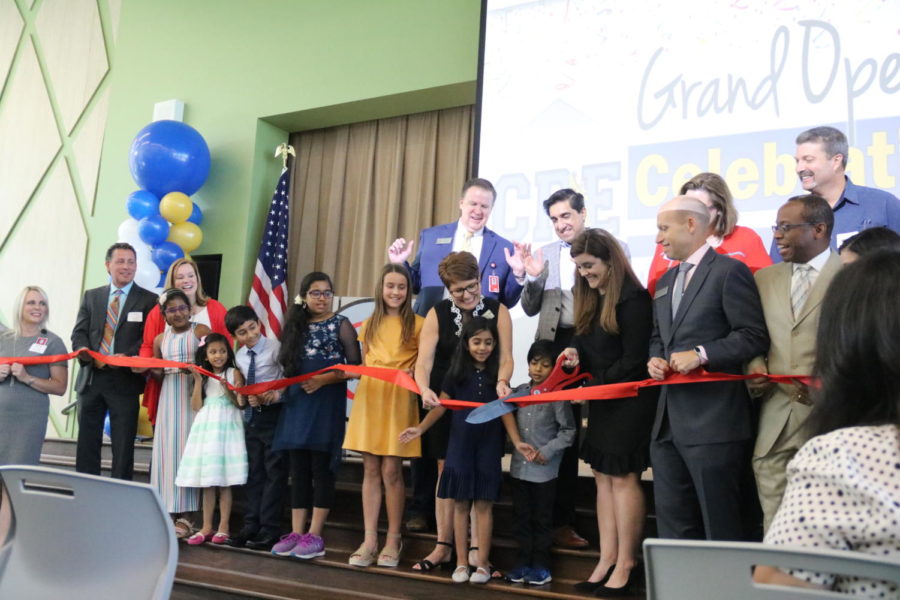 On Wednesday, Canyon Ranch Elementary Principal Ashley Minton cuts the red ribbon to commemorate the official opening of the school. CRE is the 11th CISD elementary school and was built to combat the overpopulation issues throughout CISD schools.