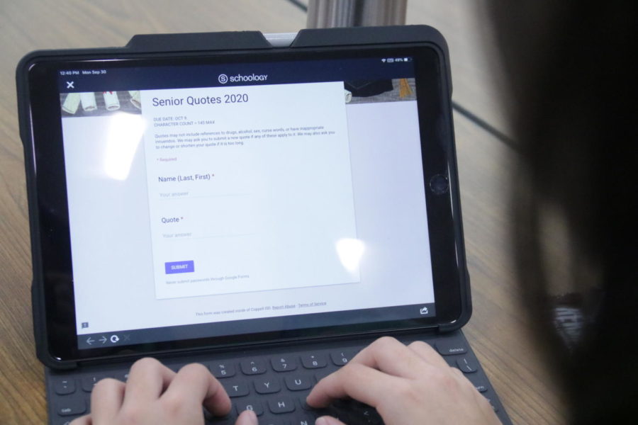 Coppell High School senior Alyssa Ramos fills out a form to submit her senior quote in the CHS Commons on Monday. This year, due to its popularity among the CHS students, senior quotes will be in the Round-Up Yearbook.