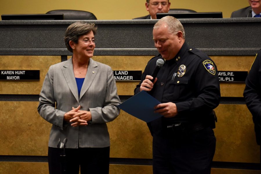 Coppell Mayor Karen Hunt listens to Coppell Police Chief Danny Barton talk about upcoming National Night Out on Oct. 1 during the Coppell City Council meeting on Tuesday at Town Center. The city also approved Hunt’s candidacy for president-elect of the Texas Municipal League.