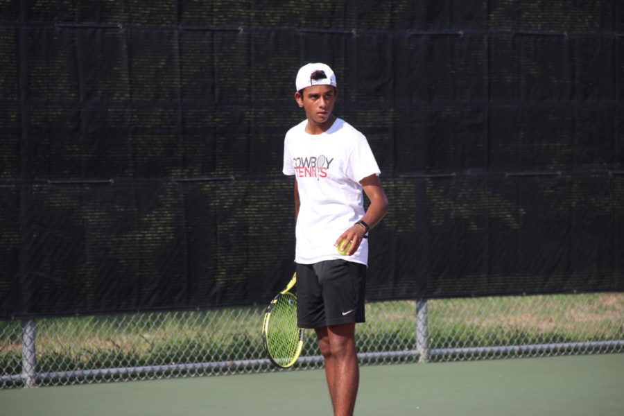 Coppell junior Kunal Seetha serves at the CHS Tennis Courts on Tuesday against Hebron during his match, a 7-6, 6-2 victory. Coppell defeated the Hawks, 13-6, in District 6-6A team tennis. 