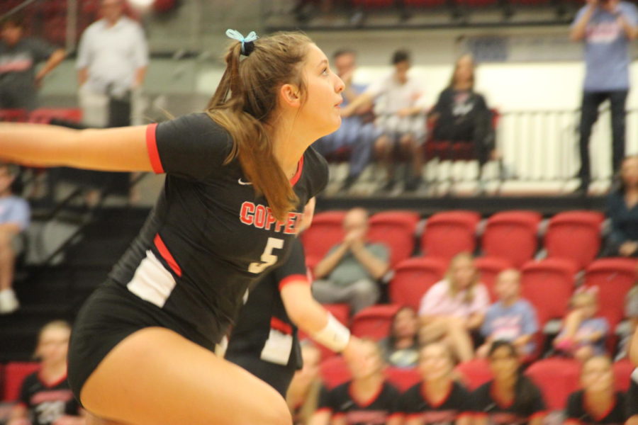 Coppell junior middle blocker Madison Gilliland prepares to spike during the match against Grapevine on Tuesday in the CHS Arena. The Cowgirls lost their final preseason match, 3-0.
