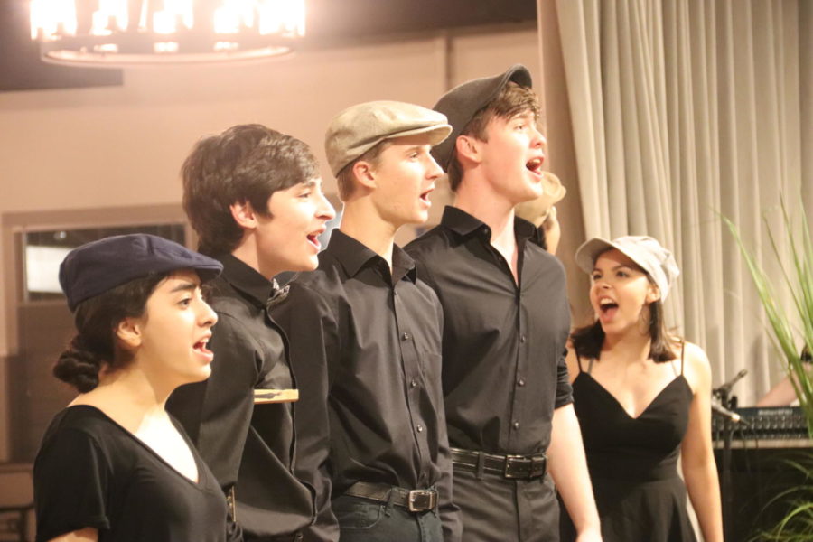Members from the cast of upcoming CHS theater production  Newsies perform a sneak peek of “Seize The Day”, a song from their upcoming musical “Newsies” at the annual silent auction and revue on Sept. 20 at Venue Forty|50 in Addison . The show runs Nov. 1-3, 9 and 10 in the CHS auditorium and tickets for the show can be found on their website. Photo by Samantha Freeman