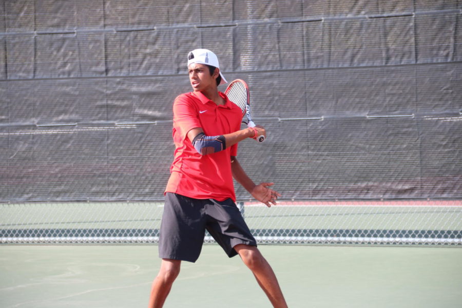 Coppell sophomore Vinay Patel prepares for a return against Longview at the Coppell High School Tennis Center on Saturday. Coppell defeated Longview, 17-2.