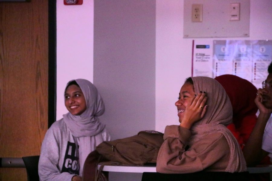 Coppell High School juniors Hidayah Husain and Sheikha Seif watch the 2019 Muslim Interscholastic Tournament (MIST) recap video during the first Muslim Student Association (MSA) club meeting of the school year on Oct. 15. This meeting helps club members understand the importance of the MSA.