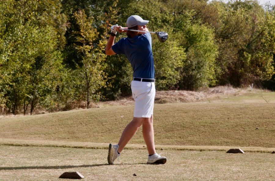 Coppell+senior+golfer+Jackson+Newsum+watches+as+his+drive+travels+down+the+fairway+on+Oct.+16+at+Riverchase+Golf+Course.+He+has+played+golf+since+age+of+2+and+intends+to+continue+working+in+golf+as+a+career.