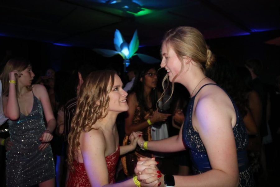 Coppell High School sophomore Shelby Magruder and junior Emily Broome dance together at CHS homecoming dance on Saturday night at Irving Convention Center. The Coppell High School homecoming dance is held annually during homecoming week, with various CHS traditional activities.