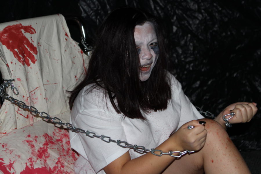 New Tech High @ Coppell senior Cosette Chiv acts in one of the rooms of the annual New Tech High Haunted House. Haunted houses have been commercialized since 1915, and the New Tech High Haunted House was first hosted In 2007. Photo courtesy of Brooke Stokes.