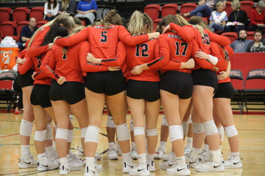 The Coppell volleyball team huddles on Senior Night in the Coppell High School Arena on Tuesday. Coppell defeated MacArthur, 3-0. 