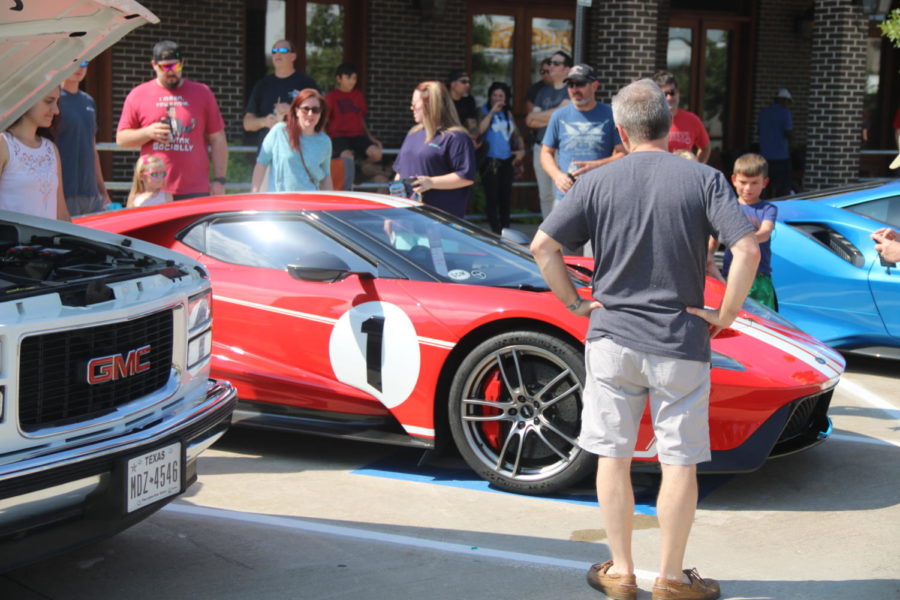 Crowd gathers around popular 2006 Ford GT on Sunday at the Coppell Car Show at Coppell Old Town Pavilion. The Coppell Car Show features many types of cars from the 70’s to the 2000’s.