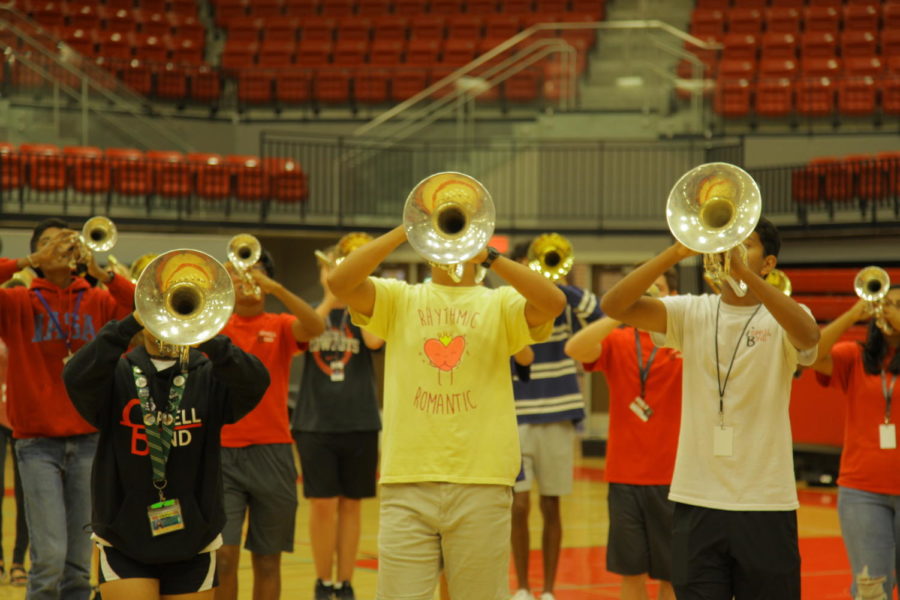 The trombone section joins the rest of the band during the chorus of the fight song before the pep rally on Friday at the CHS Arena. The CHS band performs at every pep rally.
