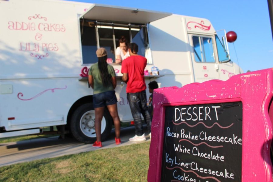 Food Truck Frenzy attendees order dessert at Addie Cakes & Lilly Pies last weekend. The annual Food Truck Frenzy took place from 5-9 p.m. on Saturday at Andrew Brown East Park. Photo by Charlotte Vanyo