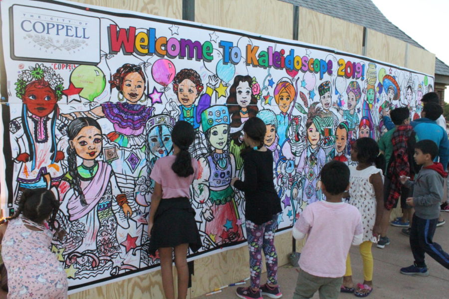 Attendees color on a mural which represents the various cultures in the Coppell community at Saturday’s Kaleidoscope at Andy Brown Park East. Kaleidoscope was held on Saturday for the third year to promote cultural diversity in Coppell.
