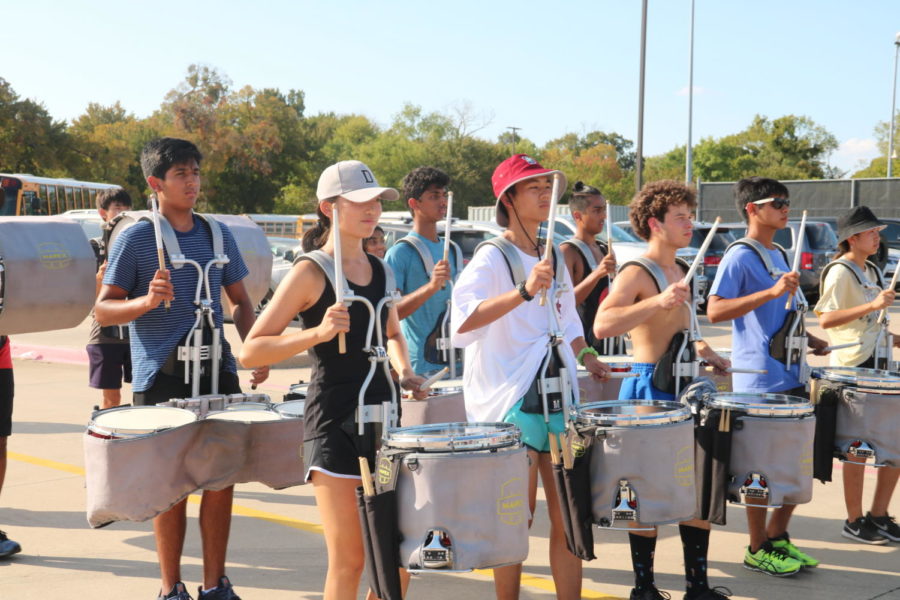 The Coppell Drumline marches after school on Sept. 26 in preparation for the Lewisville Drumline Invitational and Lone Star Classic competitions. The drumline won third place in the HEB Drumline Contest that took place Sept. 14.