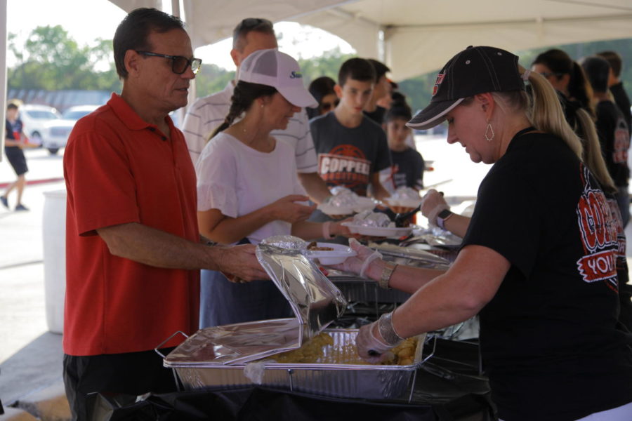 Cisd staff serve food to parents and coppell isd students. Coppell High School hosted its home game tailgate in the Buddy Echols Field parking lot on Friday before the football game against Hebron. 