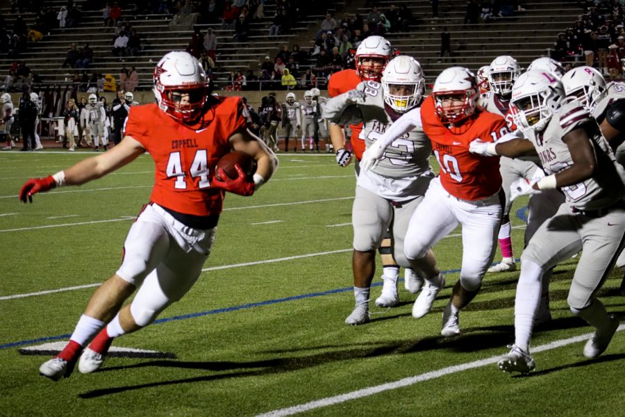 Coppell sophomore linebacker Walker Polk dashes to the endzone to score the Cowboys first touchdown of the game with 7 minutes left in the fourth quarter on Oct. 11 at Buddy Echols Field. The Cowboys lost their second district game of the season to the Farmers, 35-10.