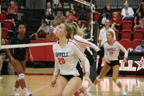 Coppell freshman outside hitter Reagan Engler prepares to block against Arlington Martin on Aug. 27 in the CHS Arena. The Cowgirls face Lewisville tomorrow at 6:30 p.m. in the CHS Arena.