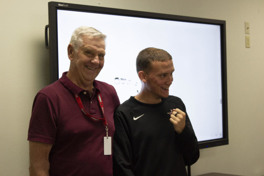 Coppell High School substitute teacher Gene McMurry shares a warm embrace with Coppell adult learner Cole Bryant during third period on Oct. 21 at CHS. McMurry is Coppell Independent School District’s first Substitute Teacher of the Month. 