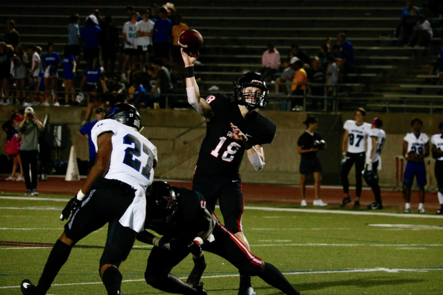 Coppell+junior+quarterback+Ryan+Walker+throws+a+pass+during+the+home+district+opener+against+Hebron+on+Oct.+4.+Walker+plays+two+offensive+positions+and+leads+the+team+in+a+pregame+speech+and+prayer.