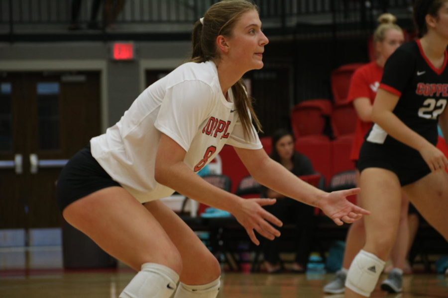 Coppell+junior+outside+hitter+Haley+Holz+awaits+a+serve+during+the+match+against+Marcus+in+the+CHS+Arena+on+Sept.+24.+Holz+is+one+of+many+high+school+athletes+playing+both+sand+and+indoor+volleyball.