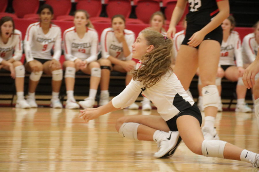 Coppell sophomore defensive specialist Beca Centeno dives in a match against Hebron in the CHS Arena on Oct. 4. The Cowgirls face Irving tonight in the CHS Arena at 6:30 p.m.