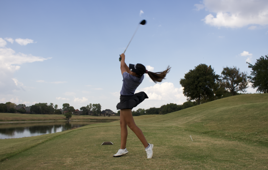 Coppell sophomore Mia Gaboriau swings during practice at Riverchase Golf Club on Oct. 3. The Coppell varsity girls golf team finished second in its first tournament of the year. 