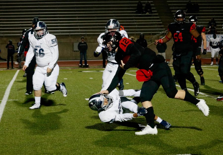 Coppell senior quarterback Kevin Shuman scores the last touchdown of the season with 8:42 remaining in the fourth quarter. Coppell defeated Irving Nimitz, 49-13, in the season finale on Friday night at Buddy Echols Field. 