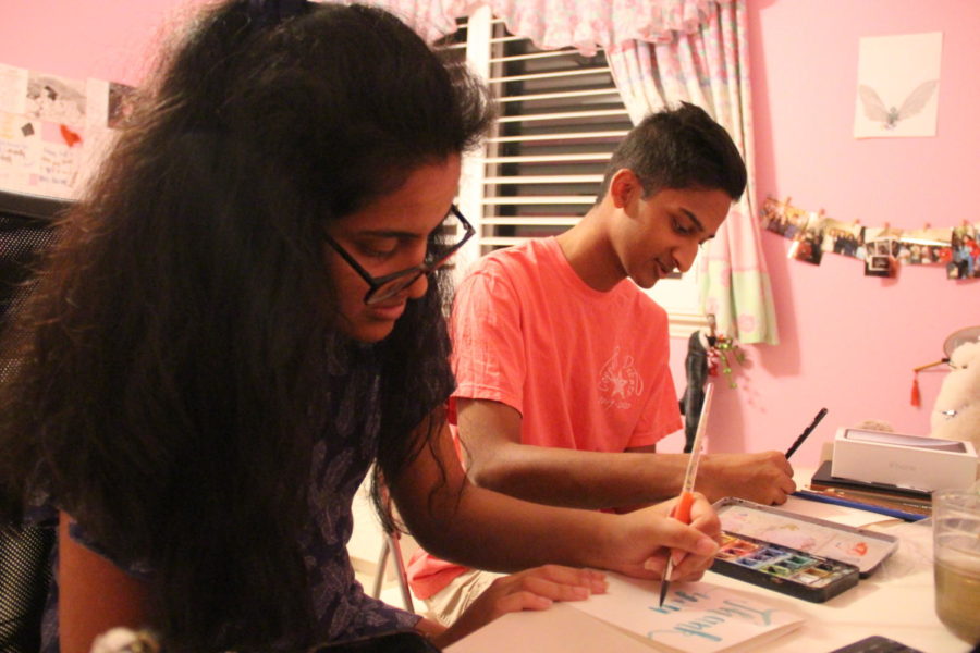 CHS9 student Maya Palavali and CHS sophomore Rohan Palavali create holiday cards at their house on Nov. 10. The Palavali siblings founded a non-profit called Pal O Valley Cards, where all profits from the sale of their custom-made greeting cards are donated to the charity Doctors Without Borders.