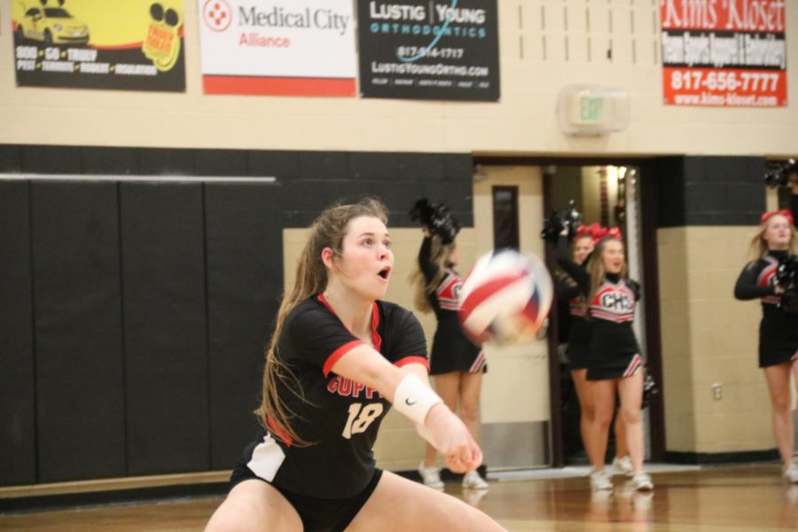 Coppell senior defensive specialist Isabelle Bowles digs during the Class 6A Region I bi-district playoff match against Byron Nelson on Tuesday at Keller Central. The Cowgirls fell to the Bobcats in three sets, 25-14, 25-21 and 25-11.