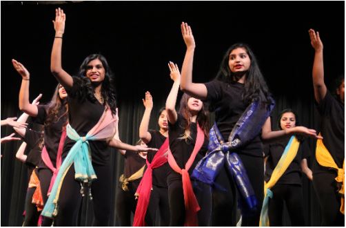 Coppell High School Respira freshman Mihira Kada and sophomore Sreeja Mudumby dance during their performance of Jai Ho. Coppell High School’s Respira hosted its annual Respira Desert Show on Friday in the CHS Auditorium. Photo by Ava Mora.
