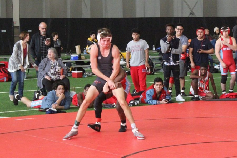 Coppell senior Garrett Hardin wrestles against Skyline senior Kundae Ange on Saturday in the CHS Field House for the 138 weight class bout, later losing the bout at the Coppell Round-Up. Coppell boys varsity took third place overall after beating Memorial, Skyline and Frisco Heritage, but losing to Northwest and Centennial. 