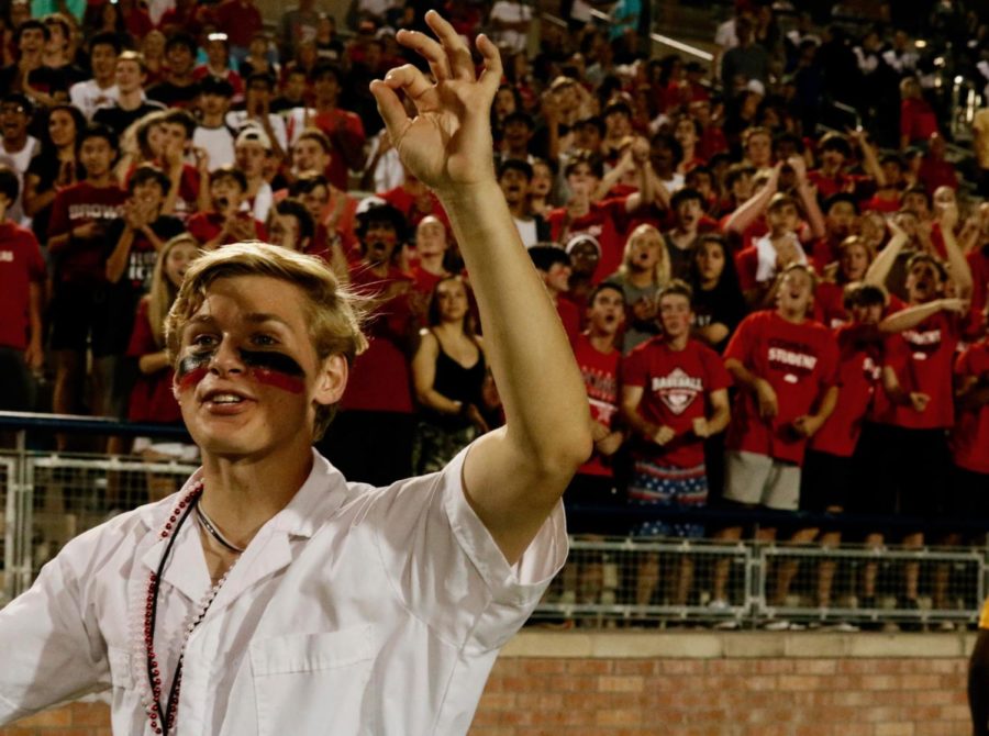 Coppell+High+School+senior+plunger+boy+Leo+Swaldi+holds+up+a+third+down+sign+during+Coppell%E2%80%99s+game+against+Allen+on+Sept.+13+at+Eagle+Stadium.+Swaldi+takes+rigorous+academic+courses+and+is+the+senior+class+president+in+addition+to+the+plunger+boy.