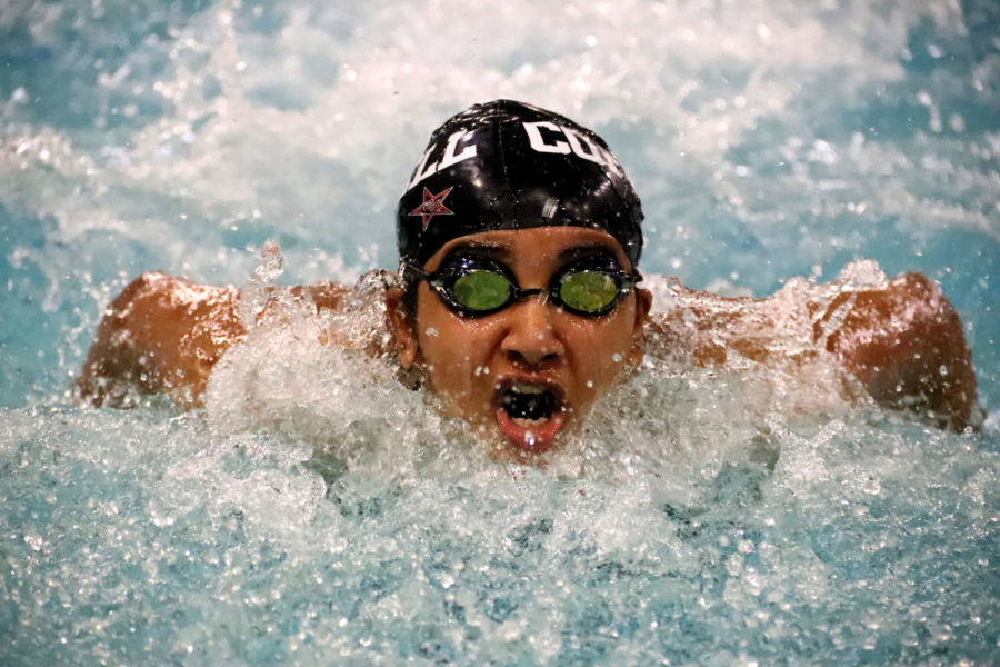 Coppell junior swimmer Shreya Tirumala competes in the varsity girls 50-yard butterfly at the Vaquero Battle at the Coppell YMCA on Friday. The semi-annual meet recognizes members of the Coppell varsity and JV swim team, as well as their teachers, in 23 events, including a teacher appreciation relay and a face-off with the CHS basketball team. Photo by Samantha Freeman.